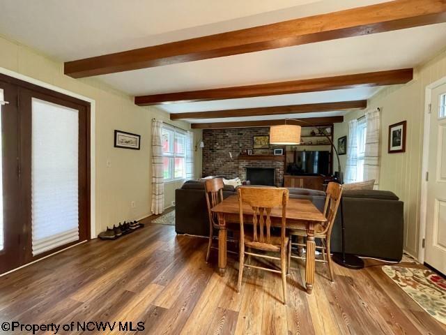 5 Key St, Elkins, WV 26241 - dining room with wood finished floors, a brick fireplace, and beamed ceiling