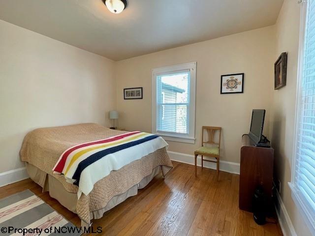 5 Key St, Elkins, WV 26241 - bedroom with wood finished floors, multiple windows, and baseboards