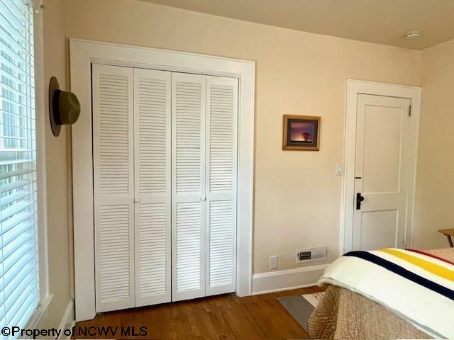 5 Key St, Elkins, WV 26241 - bedroom featuring a closet, dark wood-style flooring, and baseboards