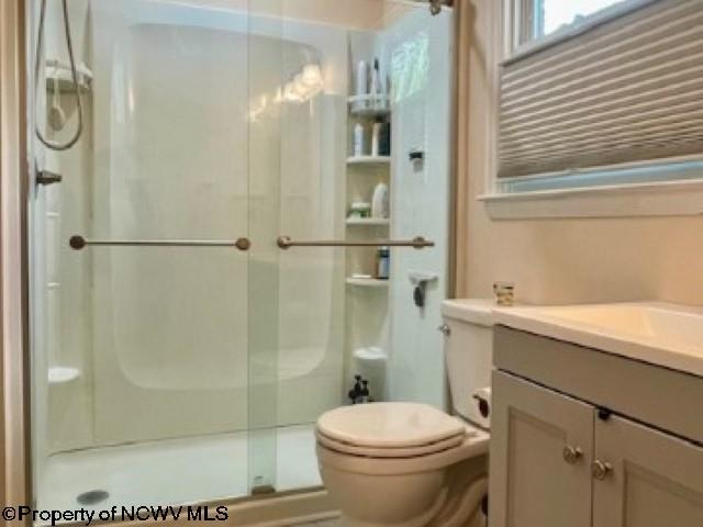 5 Key St, Elkins, WV 26241 - full bathroom featuring a stall shower, toilet, and vanity