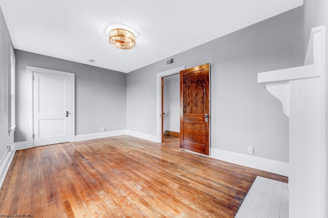 303 Saint Clair St, Clarksburg, WV 26301 - unfurnished room with baseboards and wood finished floors