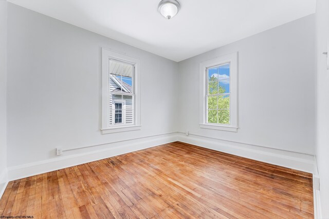 303 Saint Clair St, Clarksburg, WV 26301 - unfurnished room featuring baseboards and wood finished floors