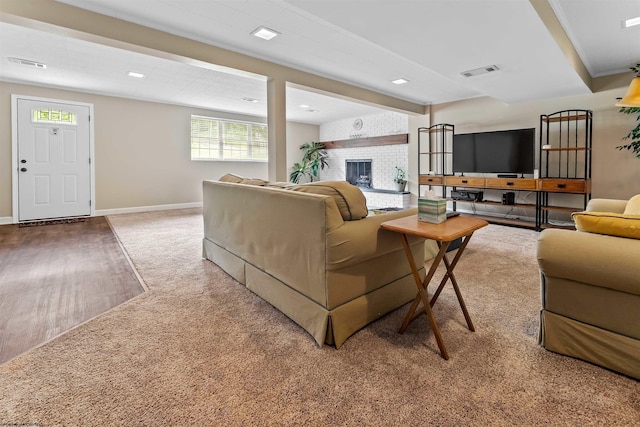 101 Forest Dr, Morgantown, WV 26505 - carpeted living room featuring a brick fireplace, baseboards, and wood finished floors