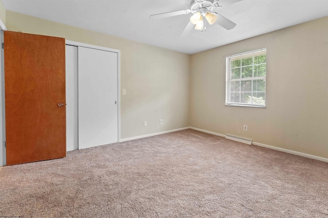 101 Forest Dr, Morgantown, WV 26505 - unfurnished bedroom with carpet flooring, a baseboard radiator, a closet, baseboards, and a ceiling fan