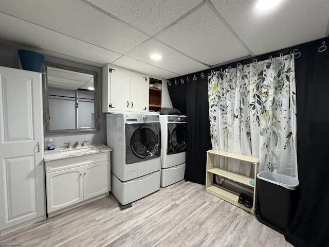 1854 Upper Lamberts Run Rd, Clarksburg, WV 26301 - washroom featuring washing machine and dryer, cabinet space, and light wood finished floors