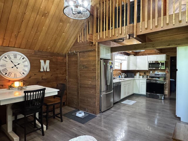 1854 Upper Lamberts Run Rd, Clarksburg, WV 26301 - kitchen with appliances with stainless steel finishes, wood walls, vaulted ceiling, a sink, and white cabinets