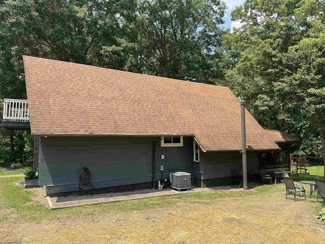 1854 Upper Lamberts Run Rd, Clarksburg, WV 26301 - rear view of house with a shingled roof, central AC unit, and a yard