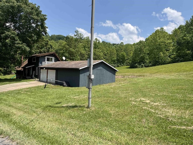 1854 Upper Lamberts Run Rd, Clarksburg, WV 26301 - view of side of home featuring a lawn, a forest view, and concrete driveway
