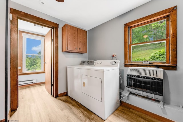 14318 N Preston Hwy, Bruceton Mills, WV 26525 - laundry area featuring heating unit, baseboard heating, light wood-type flooring, and cabinet space