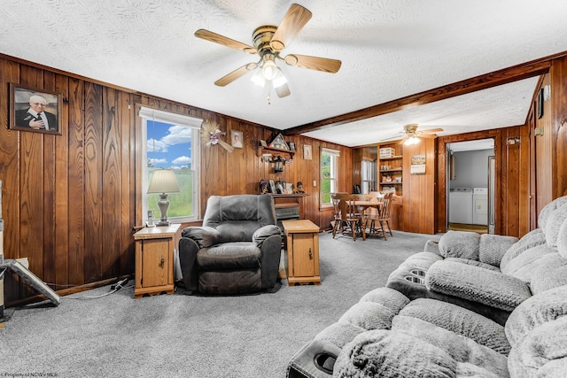 14318 N Preston Hwy, Bruceton Mills, WV 26525 - living area featuring washer and dryer, wood walls, carpet floors, a ceiling fan, and a textured ceiling