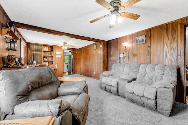 14318 N Preston Hwy, Bruceton Mills, WV 26525 - carpeted living area featuring wood walls, ceiling fan, beamed ceiling, and a textured ceiling