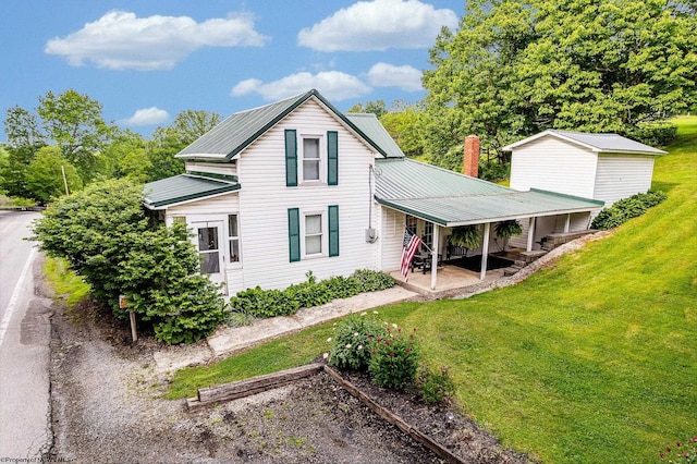14318 N Preston Hwy, Bruceton Mills, WV 26525 - view of property exterior with a yard and metal roof