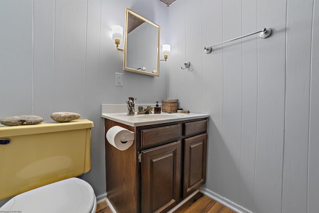 1457 Dogwood Ave, Morgantown, WV 26505 - half bath featuring wood finished floors, vanity, toilet, and baseboards