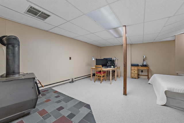 1457 Dogwood Ave, Morgantown, WV 26505 - finished below grade area featuring a wood stove, a paneled ceiling, and carpet