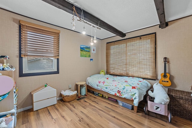 1457 Dogwood Ave, Morgantown, WV 26505 - bedroom with wood finished floors, beamed ceiling, and baseboards