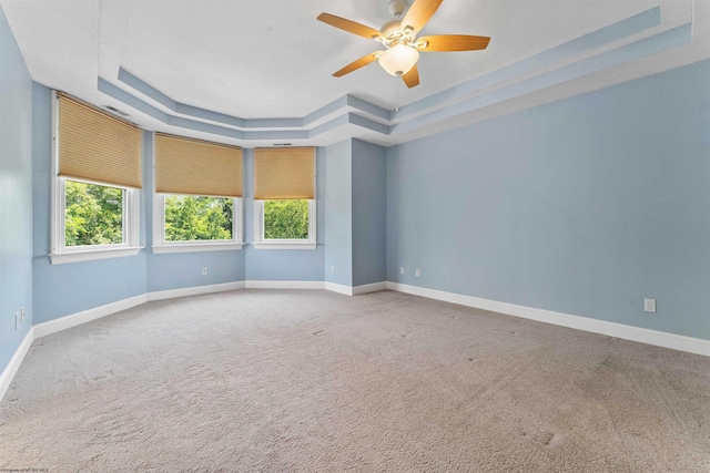 1300 Deer Run, Morgantown, WV 26508 - spare room with a tray ceiling, carpet floors, ceiling fan, and baseboards