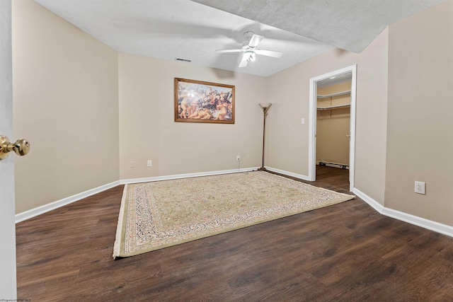 1300 Deer Run, Morgantown, WV 26508 - unfurnished bedroom with baseboards, wood finished floors, a spacious closet, a ceiling fan, and a closet