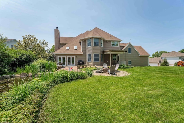 1300 Deer Run, Morgantown, WV 26508 - back of house featuring an outdoor fire pit, a patio, a lawn, a chimney, and french doors
