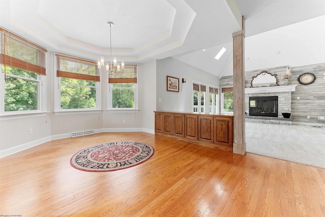 1300 Deer Run, Morgantown, WV 26508 - unfurnished living room with healthy amount of natural light, light wood-type flooring, a chandelier, and a fireplace