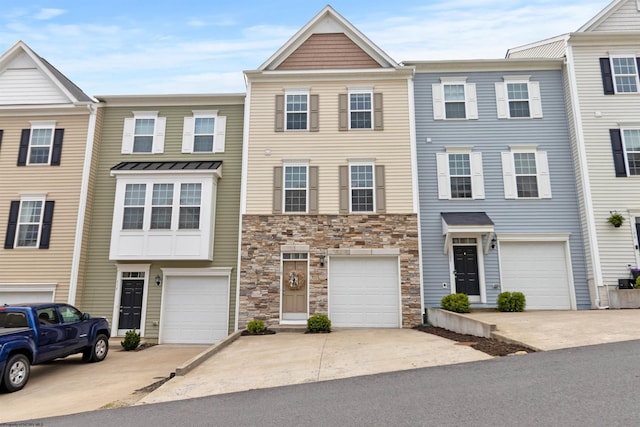 119 Inlet St, Morgantown, WV 26508 - view of property featuring driveway, stone siding, and a garage