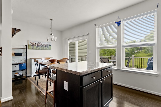 119 Inlet St, Morgantown, WV 26508 - kitchen with a chandelier, dark wood-type flooring, baseboards, hanging light fixtures, and a center island