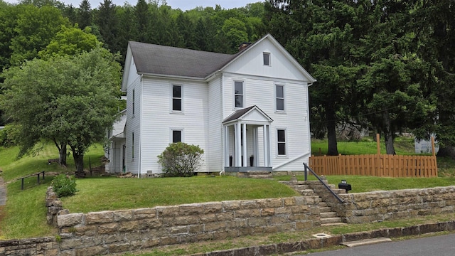 92 N High St, Philippi, WV 26416 - view of front facade featuring roof with shingles and a view of trees