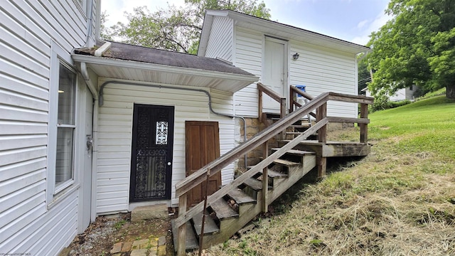 92 N High St, Philippi, WV 26416 - property entrance featuring roof with shingles and a yard