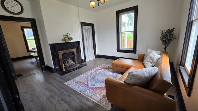 92 N High St, Philippi, WV 26416 - living room featuring wood finished floors, a fireplace with flush hearth, and baseboards