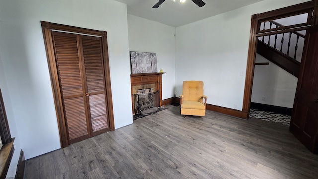 92 N High St, Philippi, WV 26416 - unfurnished room with wood finished floors, a fireplace, ceiling fan, and baseboards