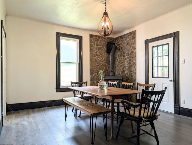 92 N High St, Philippi, WV 26416 - dining room featuring wood finished floors, a wood stove, a chandelier, and crown molding