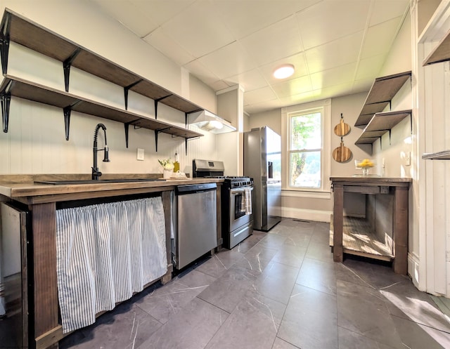 92 N High St, Philippi, WV 26416 - kitchen with open shelves, appliances with stainless steel finishes, a sink, and baseboards