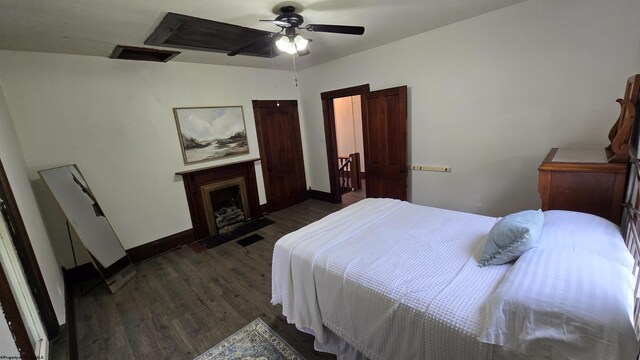 92 N High St, Philippi, WV 26416 - bedroom featuring dark wood-type flooring, baseboards, ceiling fan, and a fireplace with flush hearth