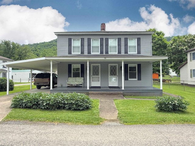 60 Sidetrack Rd Unit 2, Flemington, WV 26424 - view of front of house featuring a carport, a chimney, a front yard, a porch, and driveway