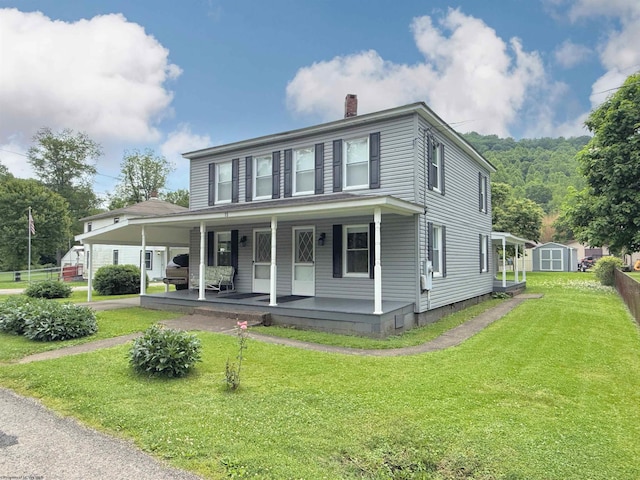 60 Sidetrack Rd Unit 2, Flemington, WV 26424 - view of front facade with a chimney, covered porch, and a front lawn