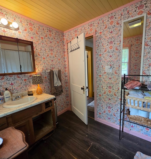 147 E 6th St, Weston, WV 26452 - bathroom with crown molding, wood finished floors, wallpapered walls, vanity, and baseboards