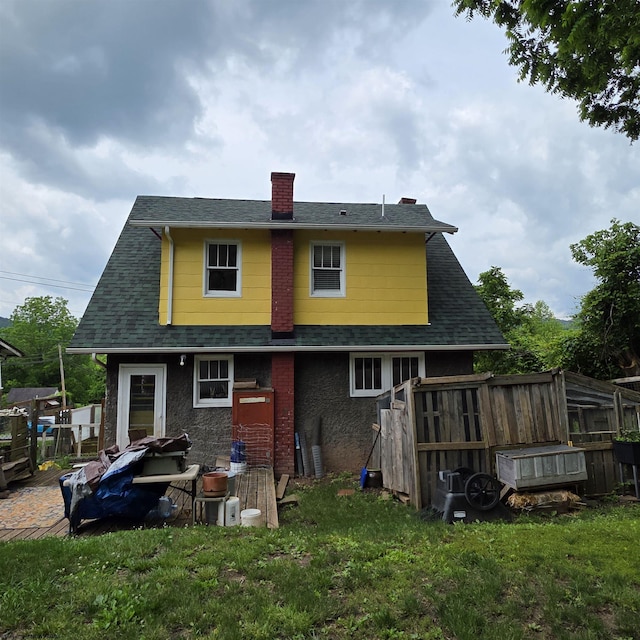 147 E 6th St, Weston, WV 26452 - rear view of property with a chimney and roof with shingles