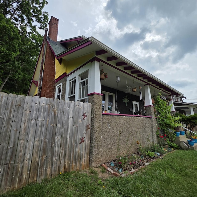 147 E 6th St, Weston, WV 26452 - view of side of property featuring a chimney and brick siding