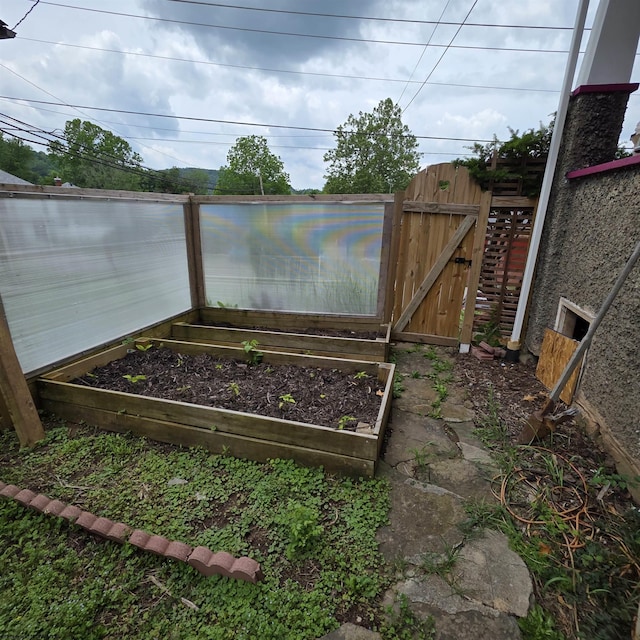 147 E 6th St, Weston, WV 26452 - view of yard featuring a gate and a garden