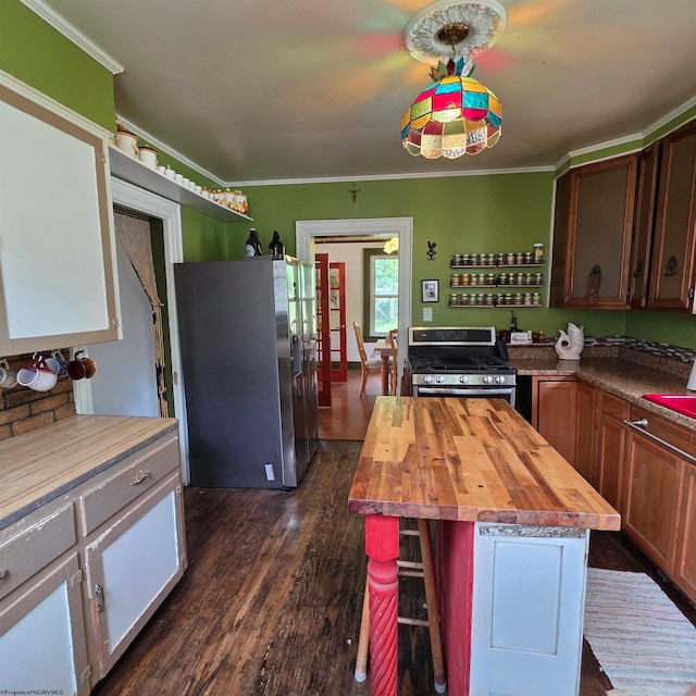 147 E 6th St, Weston, WV 26452 - kitchen featuring wood counters, stainless steel appliances, dark wood-style floors, crown molding, and a center island