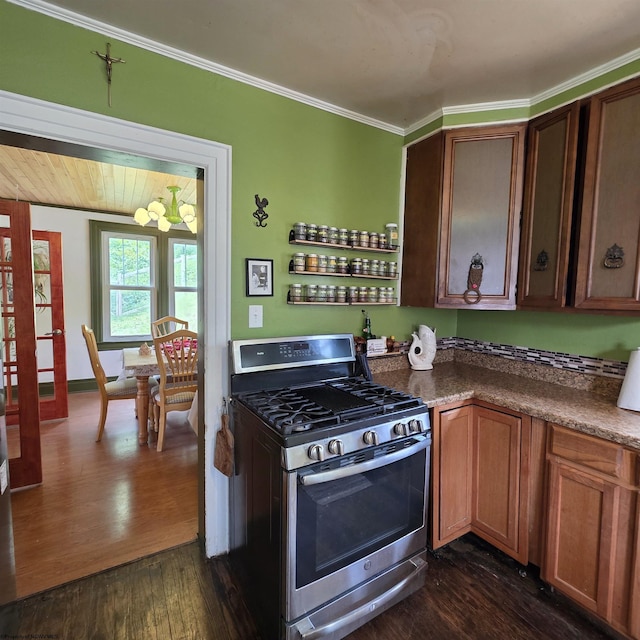 147 E 6th St, Weston, WV 26452 - kitchen featuring stainless steel gas range oven, dark wood-style floors, crown molding, a chandelier, and dark countertops