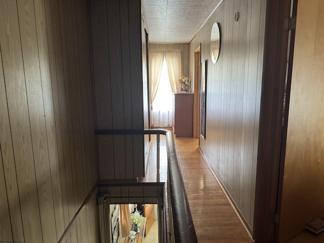 262 Henry Ave, Davis, WV 26260 - corridor featuring wood walls, wood finished floors, and an upstairs landing