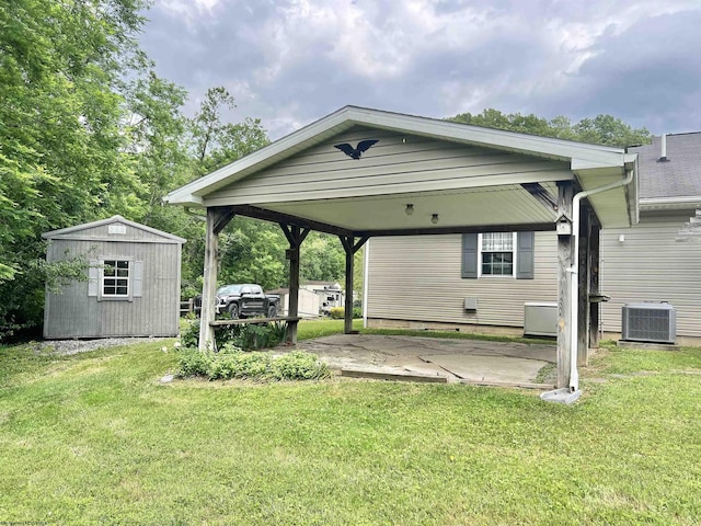 200 Heckle Ln, Elkins, WV 26241 - back of property with a storage shed, a detached carport, a yard, and a patio