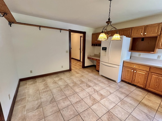 200 Heckle Ln, Elkins, WV 26241 - kitchen featuring white refrigerator with ice dispenser, decorative light fixtures, light countertops, and brown cabinetry