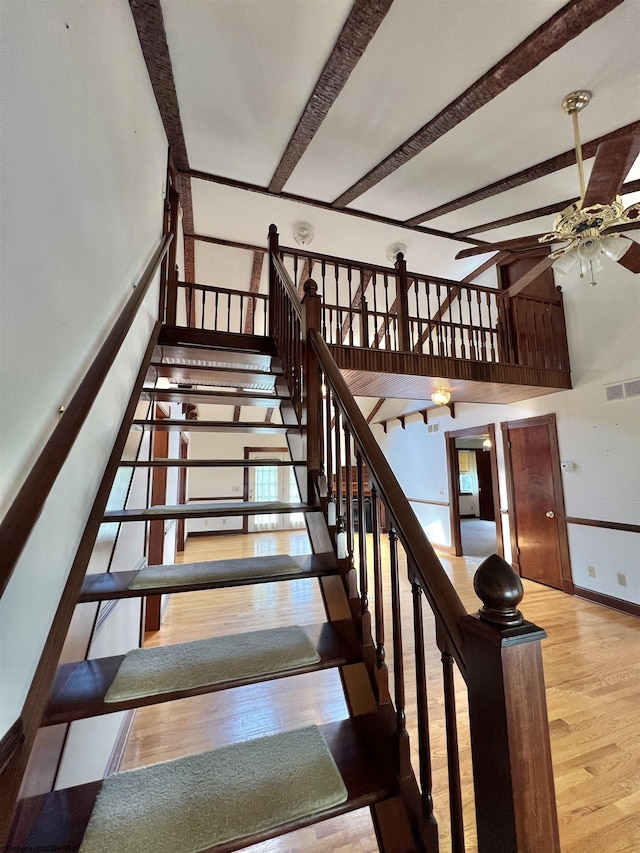 200 Heckle Ln, Elkins, WV 26241 - staircase featuring wood finished floors, a ceiling fan, and beam ceiling
