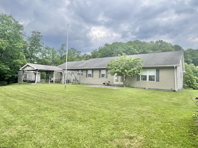 200 Heckle Ln, Elkins, WV 26241 - back of property featuring a lawn and a patio