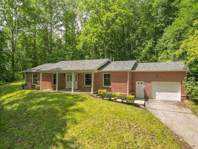700 Terrace Ave, Weston, WV 26452 - ranch-style house featuring a garage, concrete driveway, a front yard, and brick siding