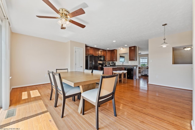 247 Birds Eye View Dr, Morgantown, WV 26501 - dining room with a ceiling fan and light wood-style floors