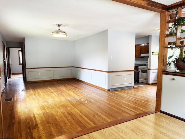 296 Old Cheat Rd, Morgantown, WV 26508 - empty room with light wood-style floors and a wainscoted wall