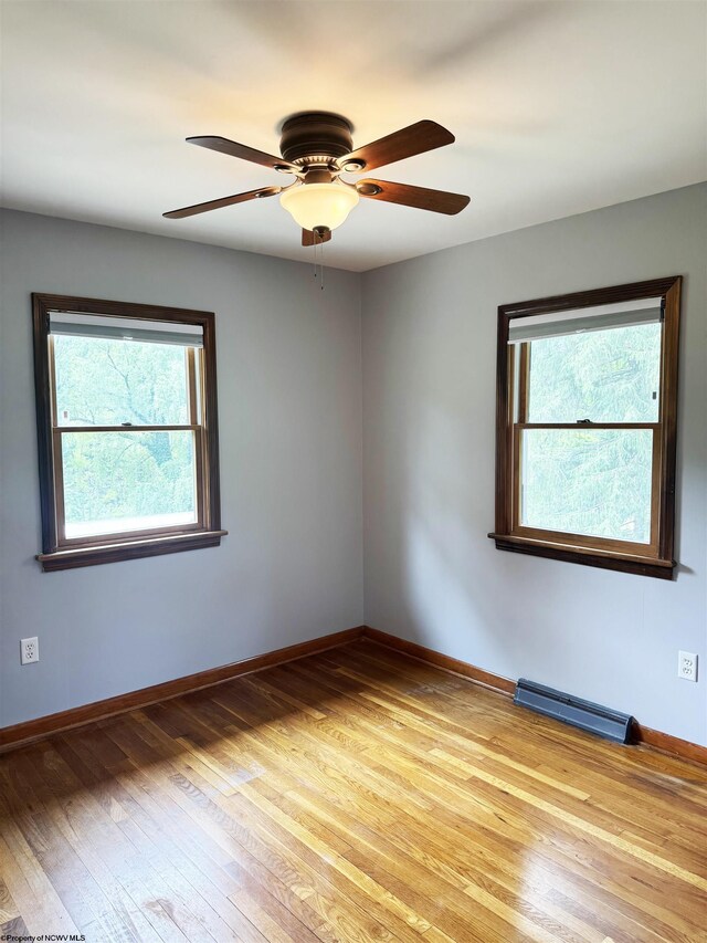 296 Old Cheat Rd, Morgantown, WV 26508 - empty room featuring healthy amount of natural light, light wood-style floors, and a ceiling fan