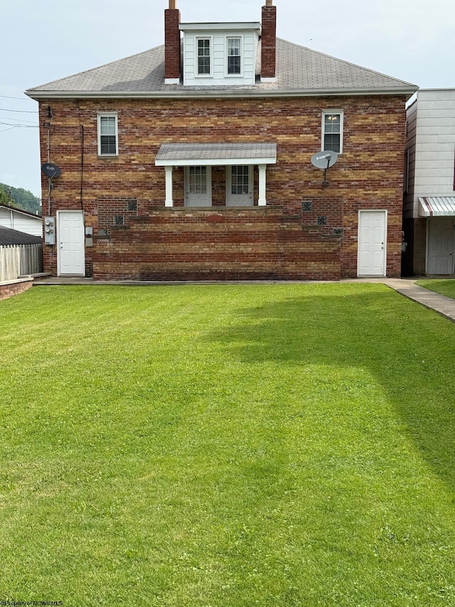 106 W Woodland Ave Unit 2, Clarksburg, WV 26301 - rear view of property featuring a chimney and brick siding